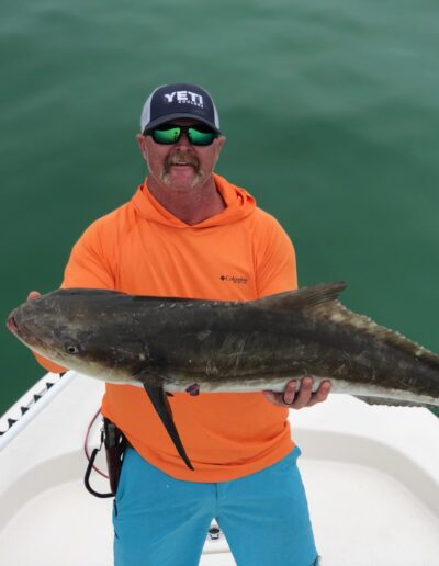 Capt Kevin Lolley Holding a Large Cobia Mexico Golf